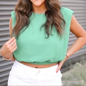 Green shoulder padded top